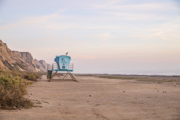 Lifeguard tower at dusk on quiet beach