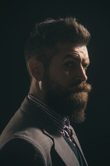 Silhouette of bearded man. Barber shop. Fashionable bearded men. Pensive man in retro clothes. Vintage fashion - man in suit, shirt, waistcoat. Man with beard and mustache in retro style