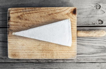 Soft Cheese  on rustic wooden background. Camembert cheese.