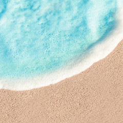 Soft Wave of Blue ocean in summer. Sandy Sea Beach  Background with copy space for text..