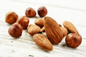 almonds and hazelnuts on white