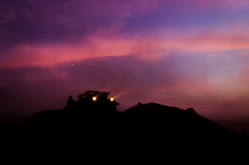 OFF-ROAD CAR - Sunset over deserted wilderness