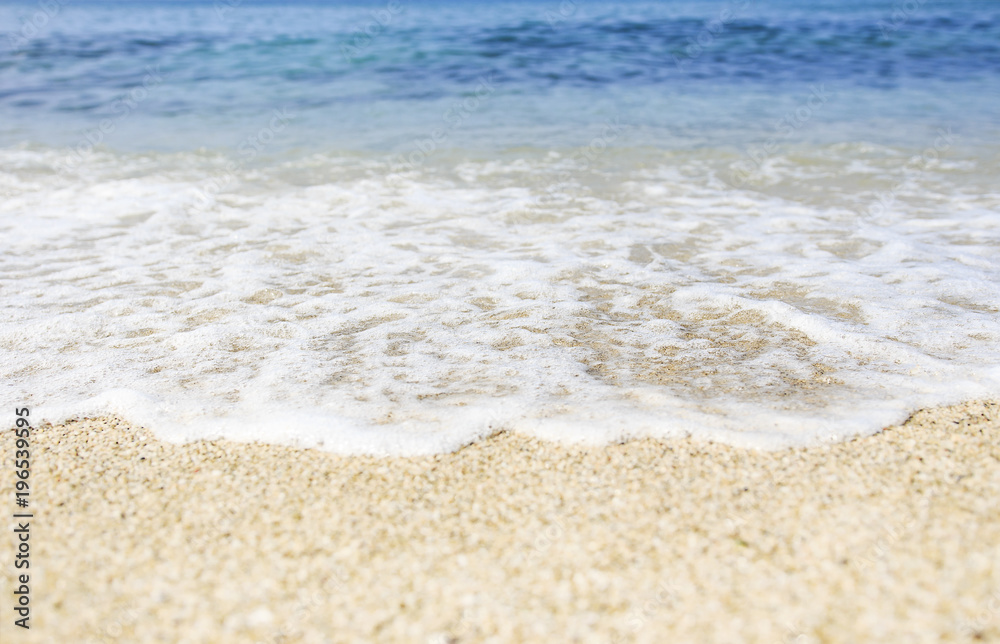 Wall mural Soft wave of blue sea on sandy Beach. Ocean beach background