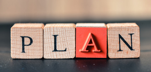 Plan close-up view of old wooden cubes with letters and symbols