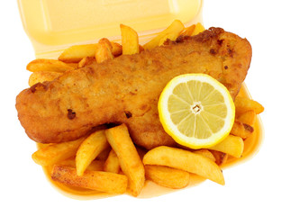 Fish and chips in a polystyrene take away tray isolated on a white background