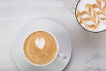 Coffee cup of cafe latte with heart latte art on top