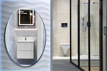 Piękna nowoczesna łazienka z kabiną prysznicową, lustrem i umywalką. - obrazy, fototapety, plakaty
