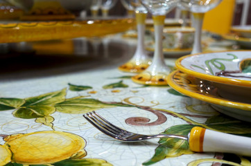 Beautifully decorated table with plates, fork and glasses.
