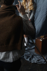 Photographer working with model in studio, vintage