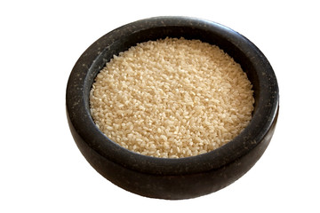 bowl with thick edges filled with dry round rice on white background