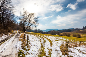 Field and agriculture land in the snow. Look to plowed field and meadow.