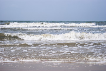 Baltic sea waves breaking on the sand beach