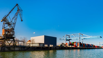 Fototapeta na wymiar Strasbourg cargo shipping port terminal, sunny day with bluew sky