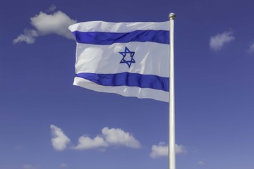 Israel flag flapping in the wind isolated against the blue sky. The flag is on a pole and flapping to the left. there are white clouds in the sky