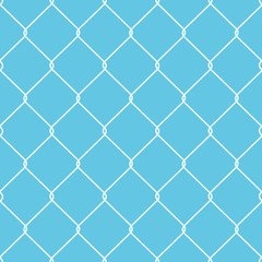 Fototapeta premium A metal wire fence with patterned diamond shapes.
