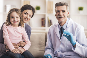 Mom with kid at the doctor.