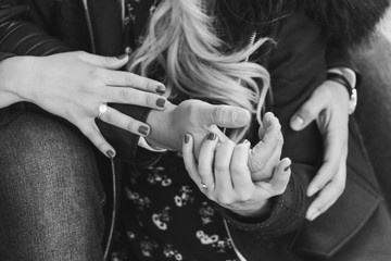 Two lovers are holding each other and holding hands as well.