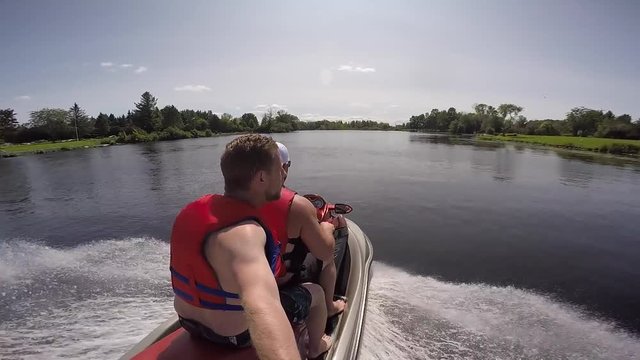 guys on seadoo selfie over shoulder view water like glass
