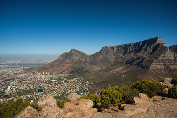 View of the Table Mountain with City on a sunny Day with blue Sky - seen from Lion's Head in Cape Town, South Africa