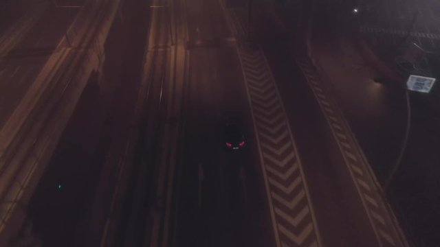 Aerial shot of traffic on a city bridge at night
