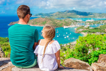 Fototapeta na wymiar Family enjoying the view of picturesque English Harbour at Antigua in caribbean sea