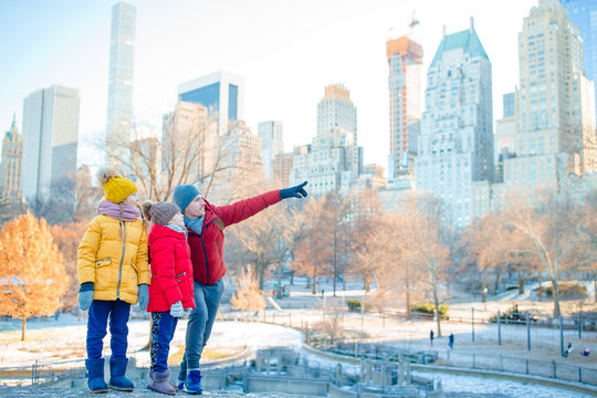 Family Of Father And Kids In Central Park During Their Vacation In New York City