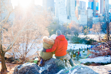 Happy couple enjoy the view of famous ice-rink in Central Park in New York City