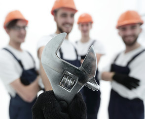 closeup. the wrench in the hands of the builders