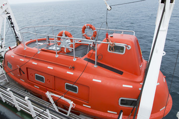 closed lifeboat on a ship