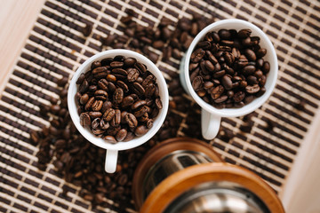 two cups of coffee on a wooden table