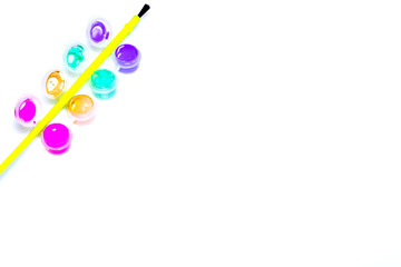 paints and brush isolated on white background