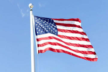 American flag on the blue sky. symbol of independence