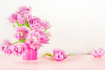 Obraz na płótnie Canvas Beautiful Bunch of Peony Style Tulips on the Pink Pot