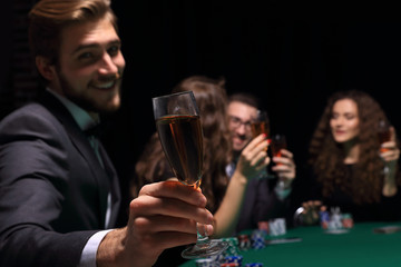poker player with a glass of wine