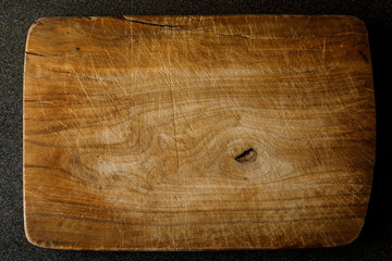 textured. Old empty wooden edging cutting board. View from above. 