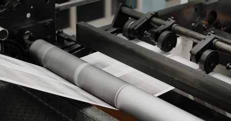 Tomorrow's newspapers are printed on a high speed printing press.