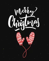 Foto op Plexiglas Merry Christmas card op zwarte achtergrond met kalligrafie en rode wanten. © Anna Kutukova