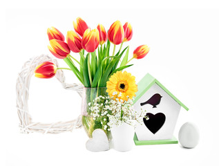 Spring composition with flowers, nesting box, egg and heart, isolated on white