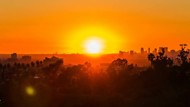 Los Angeles city views at sunset and moving lens flare - time lapse