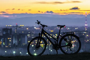 Afwasbaar Fotobehang Fietsen Modern sports city bicycle standing alone over night city background