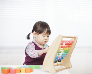 baby girl play abacus at home
