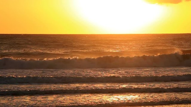 Pacific waves crashing in windy sunset 