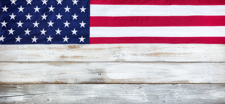 Cloth United States flag on white vintage wood plank background