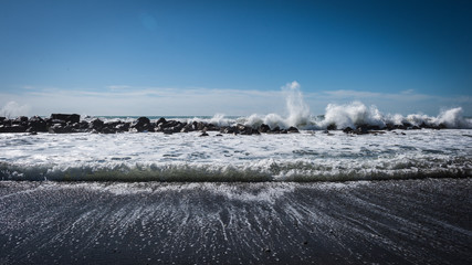 The embankment of the French city of Ventimiglia with large waves