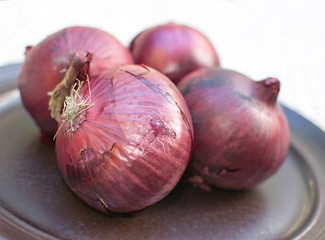 Fresh red onions plate