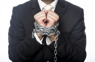 Businessman tied with chain