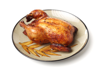 Whole roasted chicken against white background