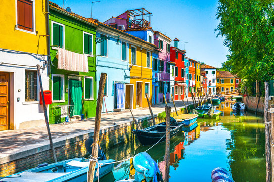 Burano island canal, colorful houses and boats,Venice, Italy