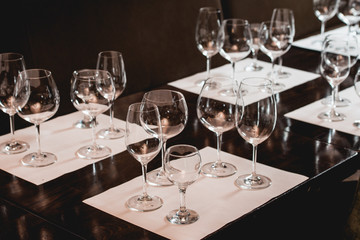empty glasses of different shapes served for a wine tasting