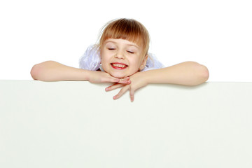 A girl is showing an advertisement on a white banner.